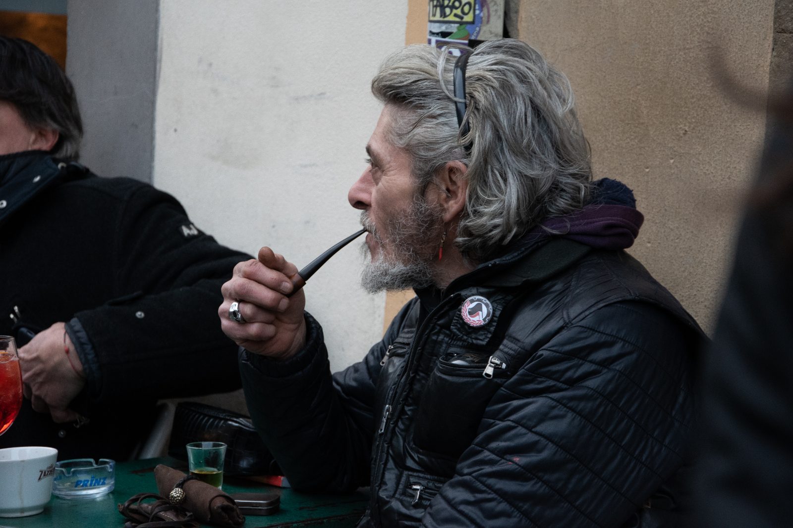 Street — a man smoking a pipe